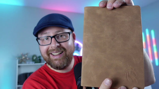 Call That Geek holding a brown LeStallion A5 faux leather journal